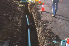 The blue pipe in the lower trench.